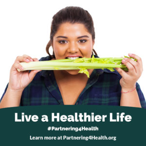 Woman eating celery